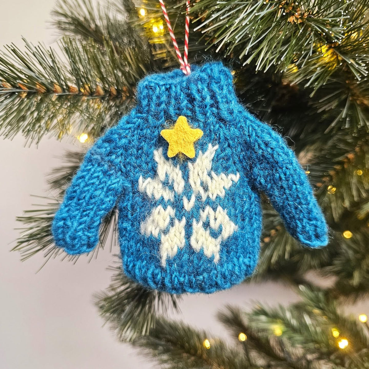 Kersthanger trui blauw
